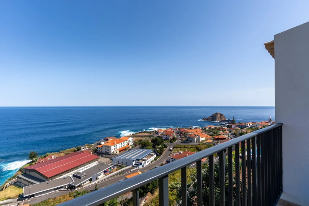 View from a balcony at Villa Domaterra II over Porto Moniz, its islet and the Atlantic on a clear day